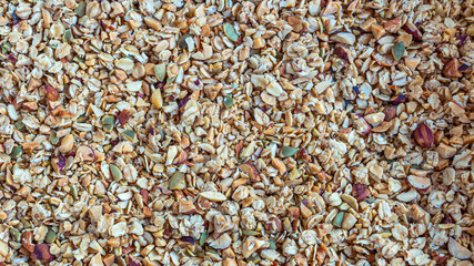 Food textured background. Home cooking healthy vegetarian snack: granola, muesli. Roasted mixed...