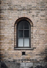 Fototapeta na wymiar Photo of a stone brick wall and a window