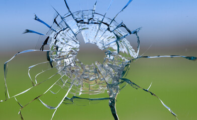 Broken glass on a green background, texture.