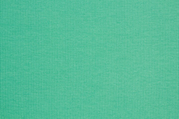 Green fabrics folded top view. Green textile	