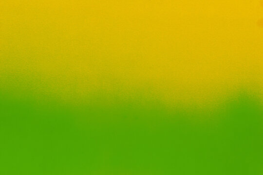 green spray paint on paper background