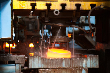 Bearing manufacturing plant. Punching outer-race ring with pressure machine and water cooling....