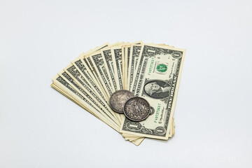 Old dollar coins and money on white background isolated