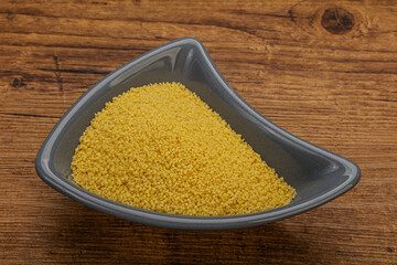 Raw cous cous heap in the bowl