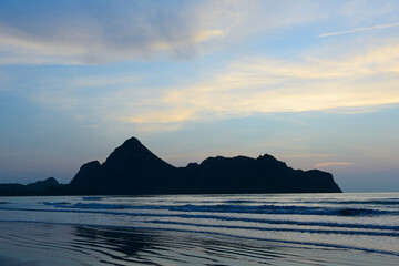 Fototapeta premium Dramatic sunset over mountain and sea.
