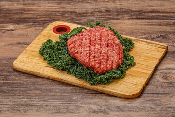 Raw beef burger cutlet for cooking