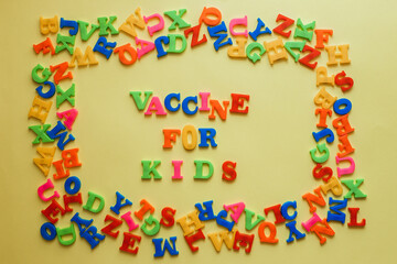 the word vaccine on a yellow background. Vaccination concept