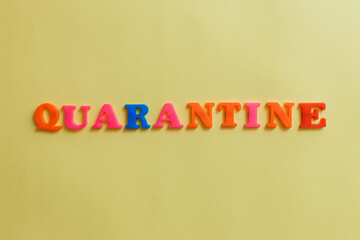 the word quarantine on a yellow background