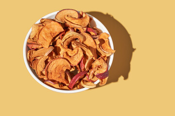 Crispy dried food. Organic tasty chips. Homemade snacks. Sliced apples. Healthy fruit.