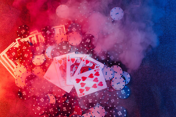 casino concept: playing cards, betting chips. Top view. Smoke added to the photo