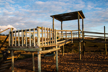 Fototapeta na wymiar Child's Jungle Gym Constructed with Wooden Poles
