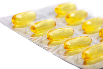 Yellow transparent pills of fish oil