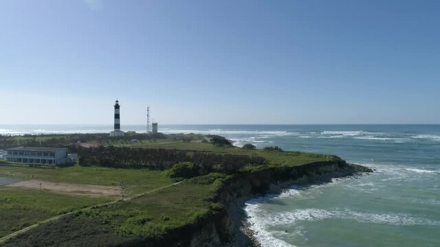 The Chassiron lighthouse at North Oleron Island in Western France, Aerial orbit around side shot