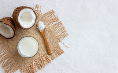 Fototapeta na wymiar Coconut milk and fresh coconuts. Vegetarian food. Healthy eating.