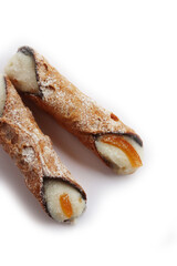 Italian traditional pastry called Cannolo siciliano isolated on white background. Cannolo filled with ricotta cheese and chocolate with Orange candied zest