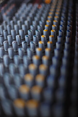 Obraz premium Professional audio studio sound mixer console board panel with recording , faders and adjusting knobs,TV equipment.