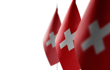 Small national flags of the Switzerland on a white background