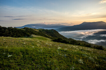 Plakat Walking in the mountains.Mount Demerdzhi in the Crimea. Sunset on the mountain. Fog in the mountains.