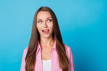 Fototapeta premium Photo portrait girl cunning thinking about dessert hungry licking lips isolated vivid blue color background