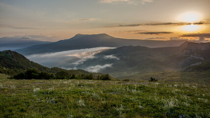 Walking in the mountains.Mount Demerdzhi in the Crimea. Sunset on the mountain. Fog in the mountains.