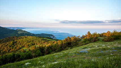 Walking in the mountains.Mount Demerdzhi in the Crimea. Sunset on the mountain. Fog in the mountains.