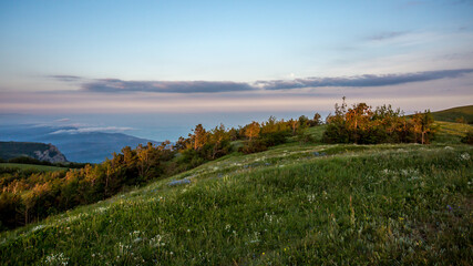 Walking in the mountains.Mount Demerdzhi in the Crimea. Sunset on the mountain. Fog in the mountains.