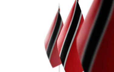 Small national flags of the Trinidad and Tobago on a white background