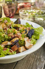 Very tasty salad of prosciutto, crackers, lettuce, basil and mustard sauce