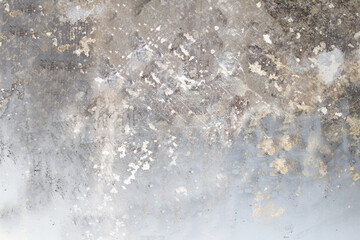The wall is gray with scratches and damage on the surface close-up