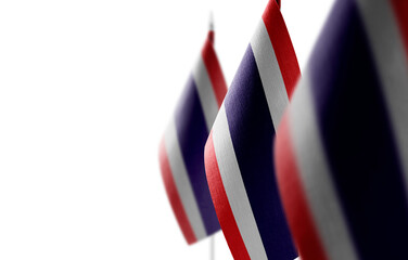 Small national flags of the Thailand on a white background