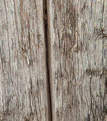 dark gray grunge wood texture - wooden background with crack, split. Vertical photo.