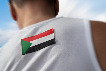 The national flag of Sudan on the athlete's back