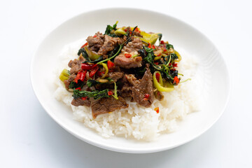 Rice topped with stir-fried beef with holy basil