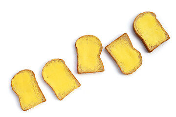 Bread slices with butter on white background.