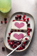 delicious ice cream with berry heart filling in middle and chia seeds water. Summer food concept. vertical image