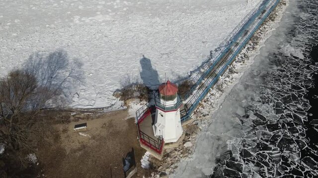 4K drone video of Cheboygan, Michigan lighthouse in winter.