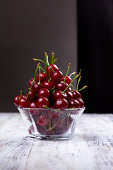 Close-up of wet cherries in glass bowl