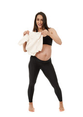 Pregnant woman holding baby clothes