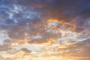 Naklejka na ściany i meble Dark orange sky evening with clouds at sunset.