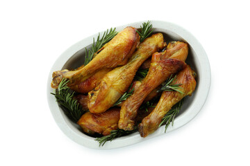 Tray of roast chicken drumsticks isolated on white background