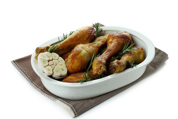 Tray of roast chicken drumsticks isolated on white background