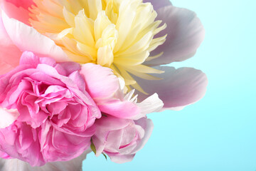 bouquet with white peonies and irises on a blue background.