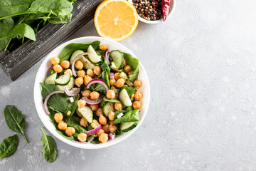 Vegetable salad with chickpeas in a plate. Dietary food. Top view. Copy space.