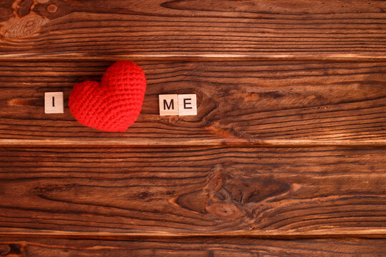 Wooden block letters written phrase I love myself on wood background. Concept mental health journaling, healthy mindset, accepting myself.
