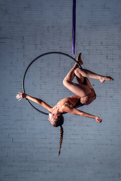 A Young Acrobat Woman Working on a Hoop
