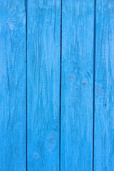 Obraz premium Old blue wooden wall of a house with cracked oil paint. Bright colorful vintage wood background
