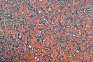 Texture of yellow, red and orange marble. Stone tile with natural pattern. Marble pavement closeup.