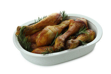 Tray of roast chicken drumsticks isolated on white background