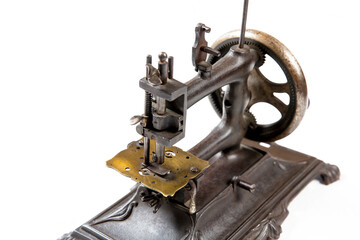 Old sewing machine on a white background