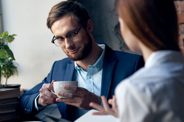business man and woman sitting in cafe socializing breakfast lifestyle